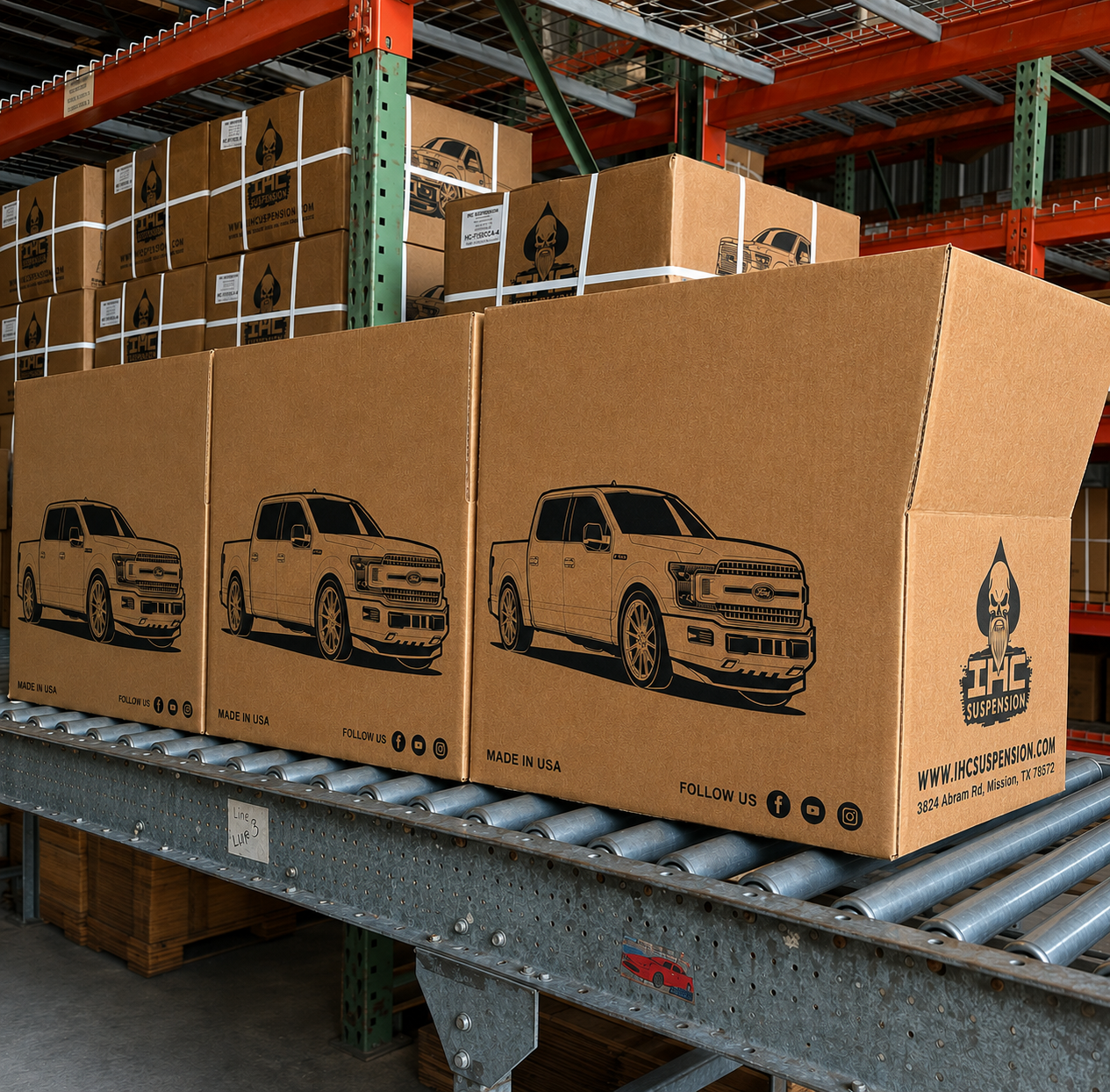 Printed IHC Suspension boxes on the line, each carrying one of the truck illustrations
